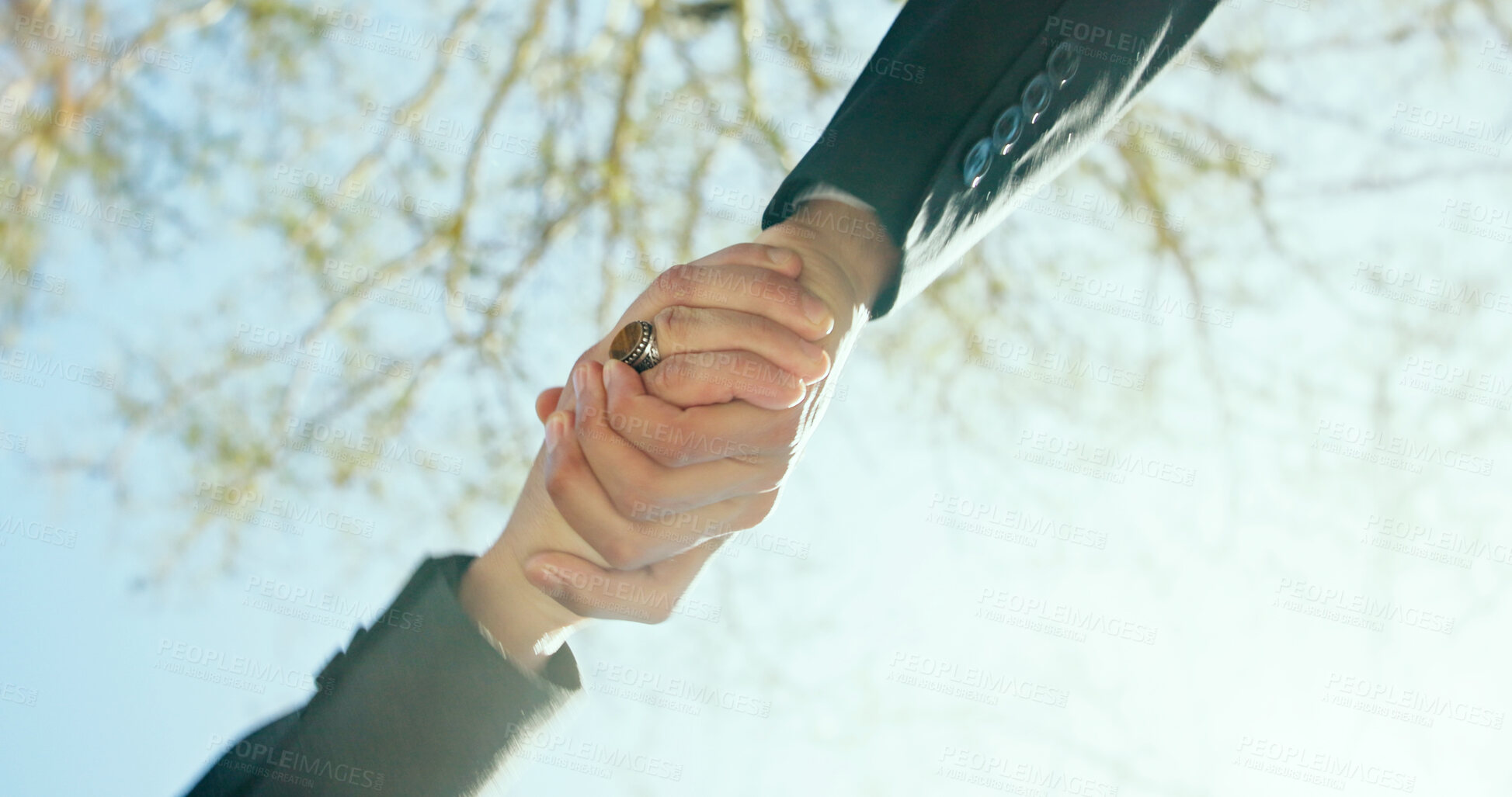 Buy stock photo Handshake, outdoor and business people with low angle, agreement and meeting with partner. Shaking hands, hello and respect with introduction, welcome and thank you for deal in urban park in morning