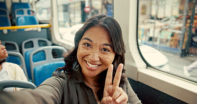 Buy stock photo Bus, selfie and portrait of woman in city for journey, morning commute and travel in city. Public transport, passenger and person take picture for social media, memory and peace sign on trip in town