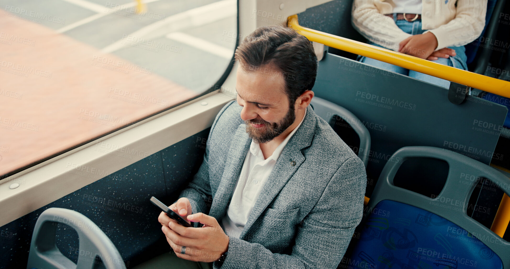 Buy stock photo Businessman, phone and texting in bus, smile and travel with web chat, search and typing email on commute. Person, smartphone and above with mobile app, window and social media on public transport