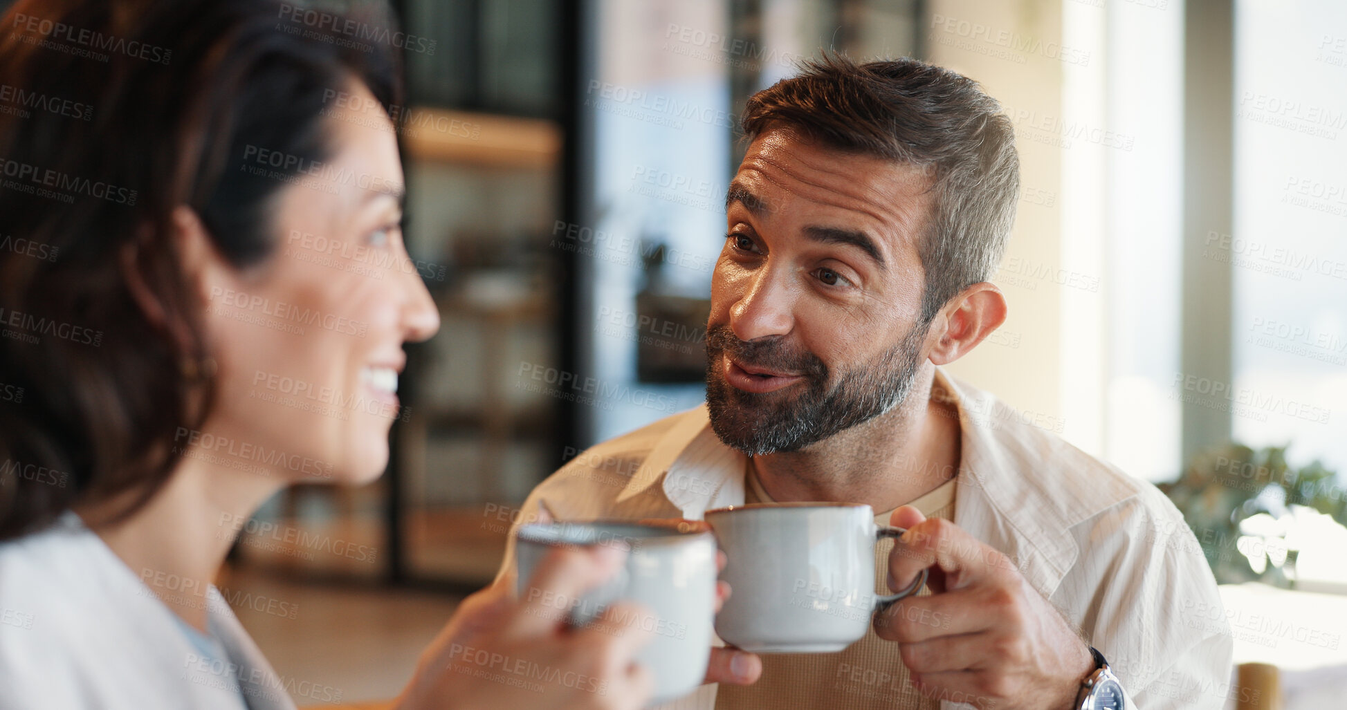 Buy stock photo Home, love and couple with coffee, conversation and bonding together in lounge. Care, relax and man with woman, cappuccino and relationship with discussion, romance and happiness with morning or talk