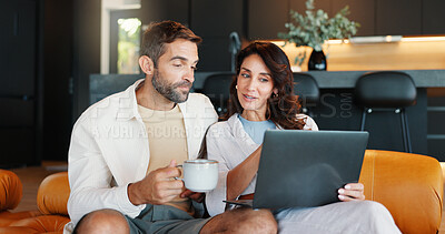 Buy stock photo Home, conversation and couple on couch, laptop and internet with coffee in living room. Apartment, man and woman with computer, website info and discussion for entertainment, connection and latte