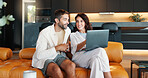 Home, discussion and couple on sofa, laptop and connection with comfort in lounge. Email, man and woman on couch, computer and conversation with entertainment, internet and relax with website info