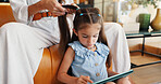 Hands, mom and hairstyle for child, home and bonding with daughter in living room, haircare or love. Care, mother and grooming hair for kid, cosmetics and shine of hairdo, texture or person in lounge