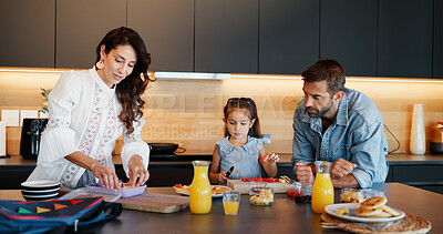 Buy stock photo Parents, girl and packing lunch box in kitchen with sandwich, fruit or excited for back to school. Dad, mother and daughter with smile for bread, snack or meal for nutrition with child in family home