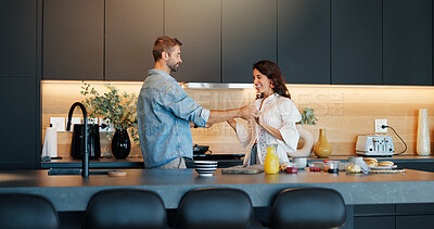 Buy stock photo Mature couple, dancing and cooking in kitchen with love, bonding and celebration for anniversary in home. People, man and woman with holding hands, happy and playful rhythm with relationship at house