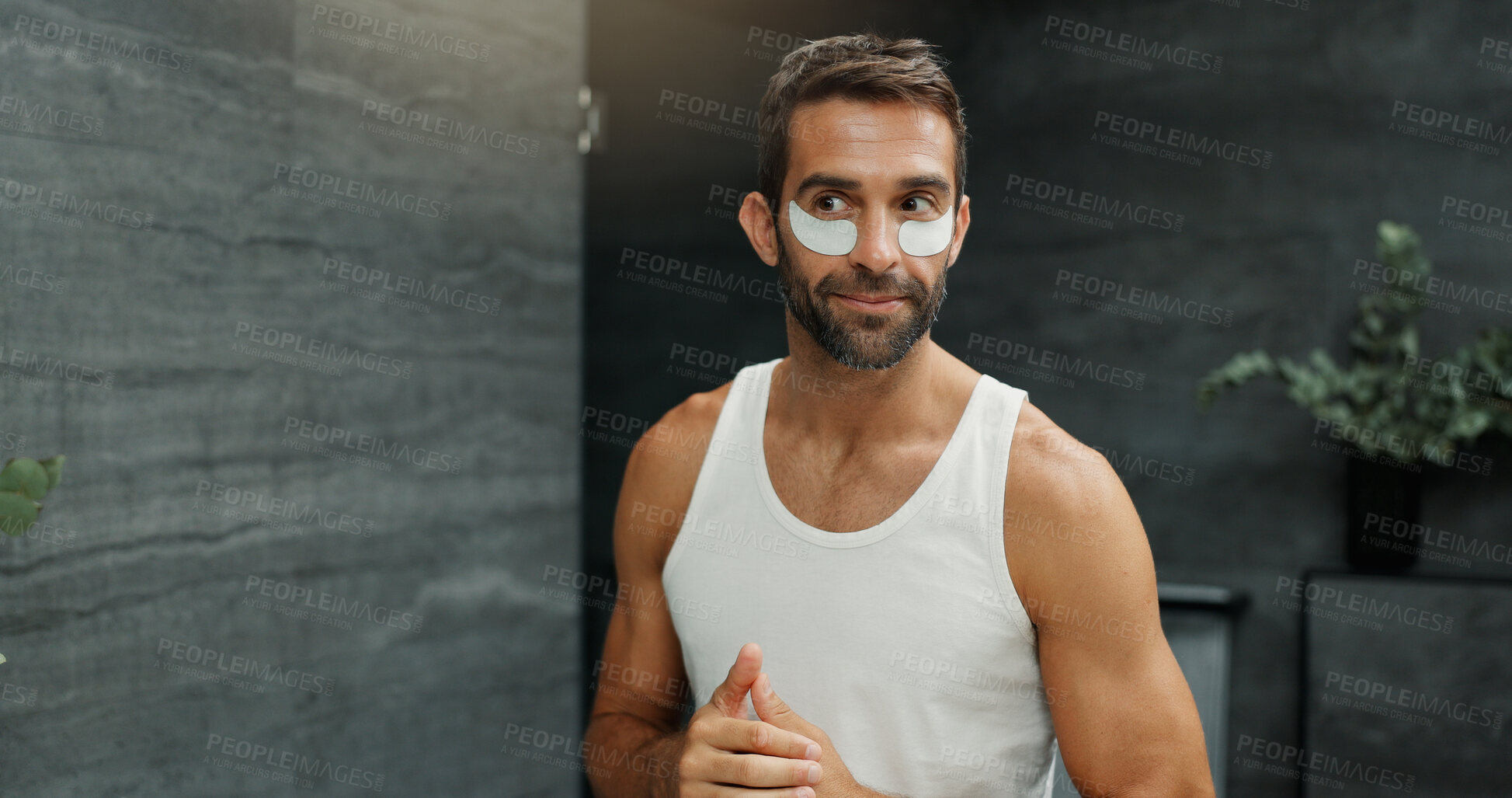 Buy stock photo Beauty, eye mask and facial with man in bathroom of home for antiaging cosmetology or wellness. Cosmetic product, dermatology and treatment application with person in apartment for morning skincare