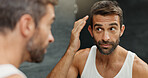 Man, mirror and check for hair care in bathroom for styling, grooming routine and natural texture. Male person, reflection and growth inspection for beauty, maintenance treatment and results at house