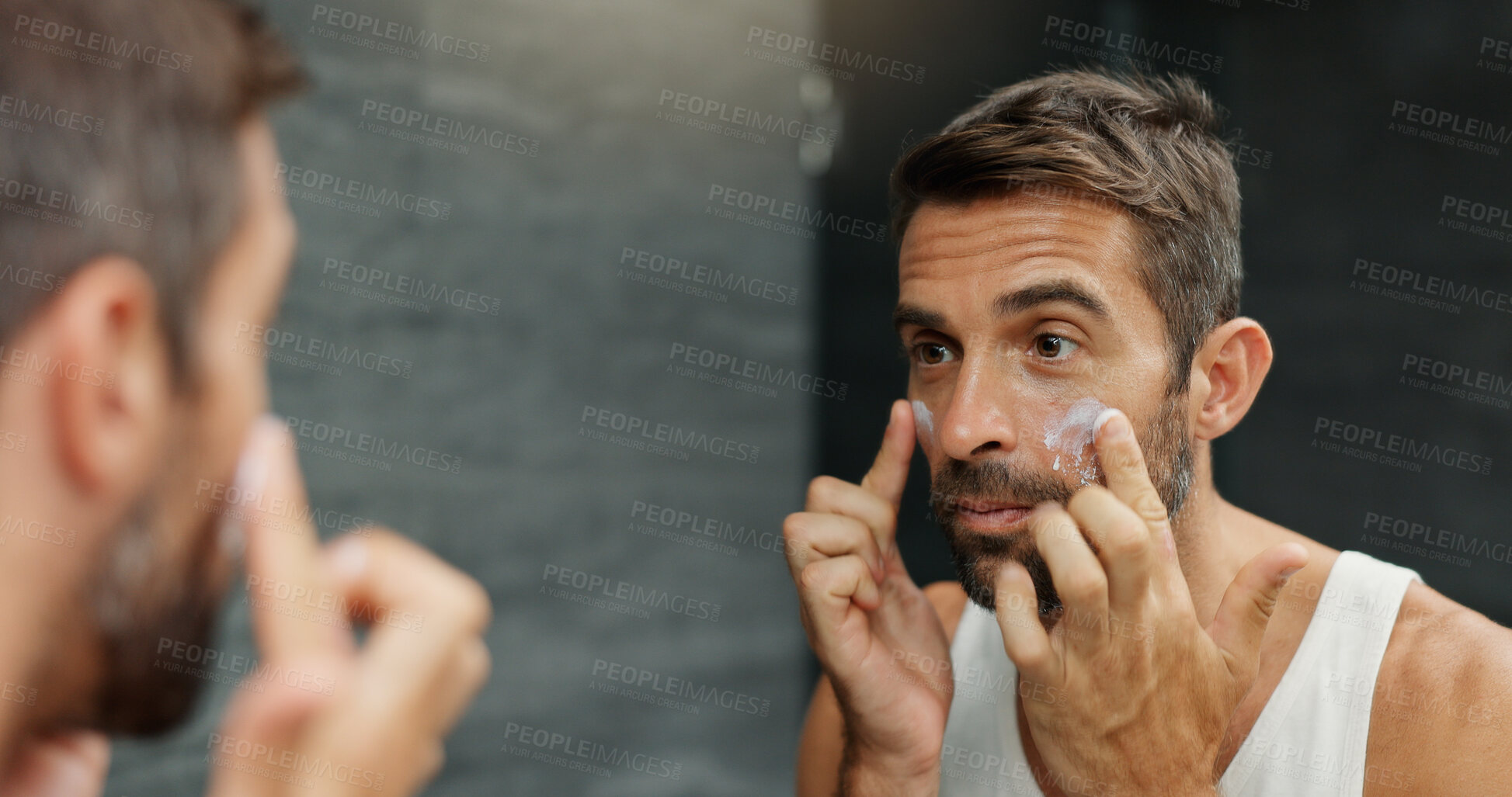 Buy stock photo Skincare, mirror and man with face cream in bathroom for skin hydration, grooming treatment and morning routine. Hygiene, reflection and spf lotion application for moisturizer, wellness or anti aging