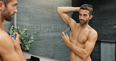 Buy stock photo Deodorant, bathroom and man in mirror in home for grooming, hygiene and scent for cleaning. Morning routine, wellness and person with underarm, spray and antiperspirant product for sweat for health