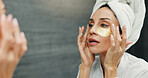 Eye mask, mirror and skincare with woman in bathroom of home for antiaging cosmetics or wellness. Beauty, facial product and reflection with person in apartment for morning dermatology routine
