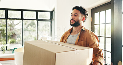 Buy stock photo New house, happy and man with box, real estate and ownership of property with mortgage and lounge. Relocation, buyer and person with cardboard in living room, investment and purchase with home loan