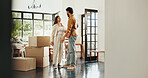 Property, boxes and couple with talking in new home for mortgage investment, moving in or house purchase. Homeowner, happy people and pride for growth, achievement or real estate success with support