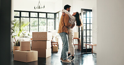Buy stock photo Celebration, hug and couple in new house, moving and ownership of property with mortgage or real estate. Relocation, happy and people with boxes in living room, investment and purchase with home loan