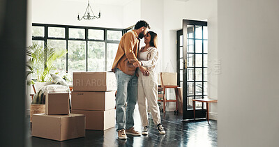 Buy stock photo Celebration, happy and couple in new house, moving or ownership of property with mortgage or real estate. Relocation, love and people with boxes in living room, investment or hug for purchase of home