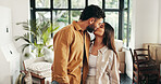 Kiss, mortgage and moving in with couple in living room of new home together for property investment. Boxes, love or marriage with happy man and woman in apartment for bonding, growth or real estate