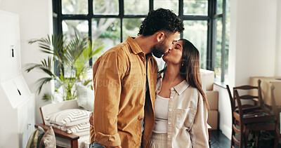 Buy stock photo Kiss, mortgage and moving in with couple in living room of new home together for property investment. Boxes, love or marriage with happy man and woman in apartment for bonding, growth or real estate