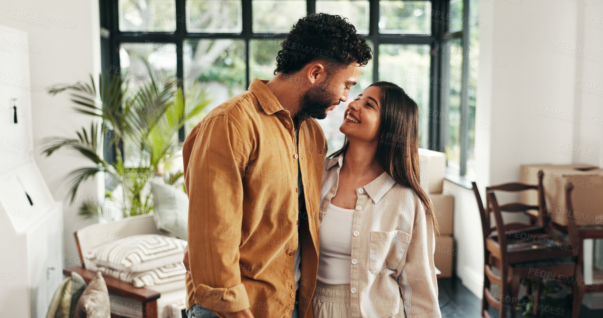 Buy stock photo Homeowner, hug and mortgage with couple in living room of new home together for property investment. Boxes, love or smile with man and woman embracing in apartment for bonding, growth or real estate