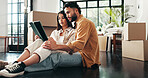 Tablet, boxes and couple in new home with planning for renovation. development or moving. Cardboard package, real estate and man with woman on digital technology for online order in apartment.