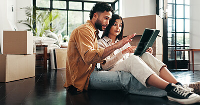 Buy stock photo Tablet, boxes and couple in new house with planning for renovation, development or moving. Cardboard package, real estate and man with woman on digital technology for online order in apartment.