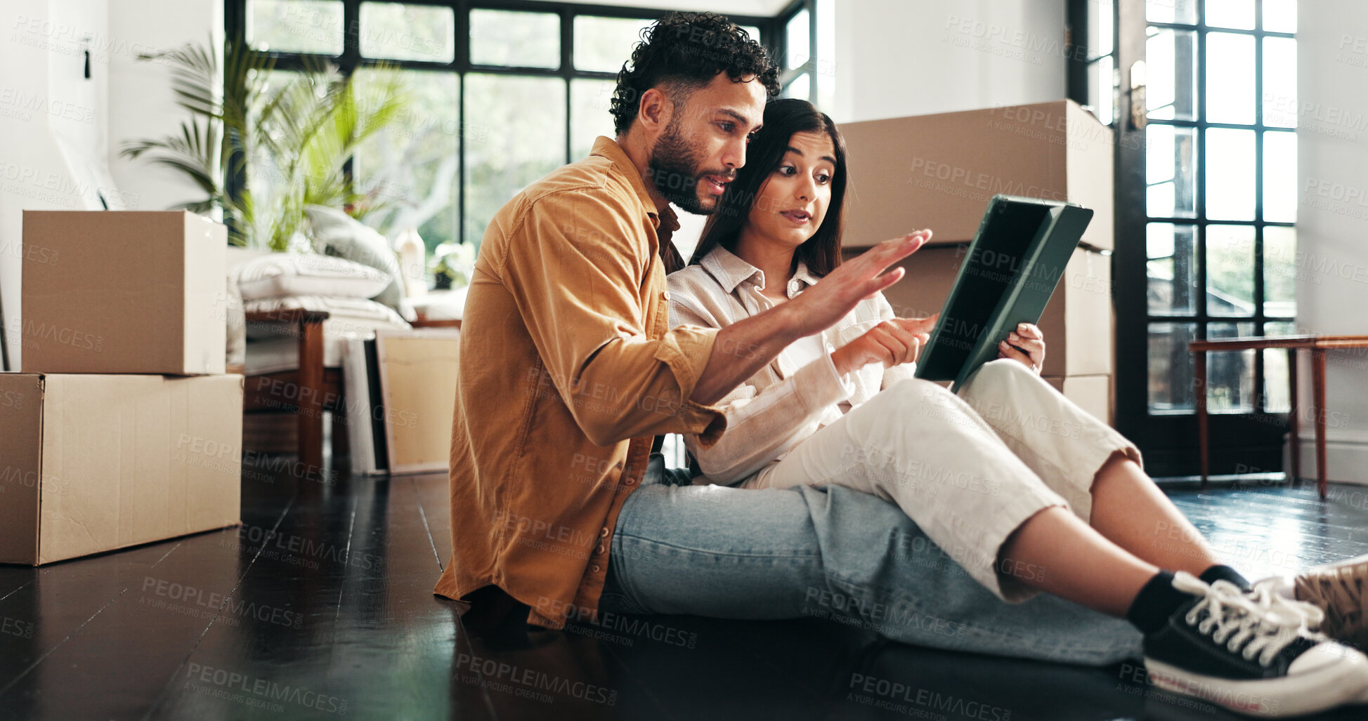Buy stock photo Tablet, boxes and couple in new house with planning for renovation, development or moving. Cardboard package, real estate and man with woman on digital technology for online order in apartment.