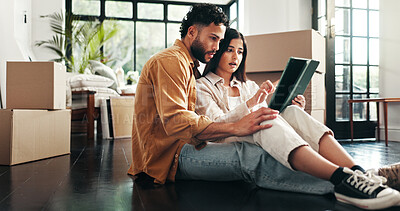 Buy stock photo Tablet, cardboard and couple in new home with planning for renovation. development or moving. Boxes, real estate and man with woman on digital technology for online order with maintenance in house.