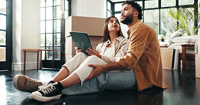 Buy stock photo Tablet, renovation and couple in new home with planning for maintenance, development or moving. Cardboard package, real estate and man with woman on digital technology for online order in apartment.