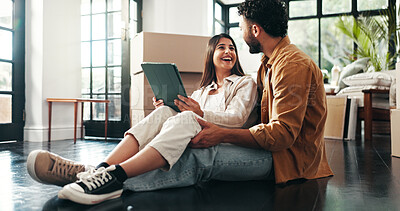 Buy stock photo Tablet, laughing and couple in new house with planning for renovation, development or moving. Cardboard packages, real estate and man with woman on digital technology for online order in apartment.