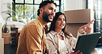 Mortgage, planning and tablet with couple in living room together for property development or investment. Boxes, love or smile with man and woman pointing in apartment for real estate or renovation