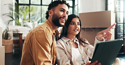 Buy stock photo Mortgage, planning and tablet with couple in living room together for property development or investment. Boxes, love or smile with man and woman pointing in apartment for real estate or renovation