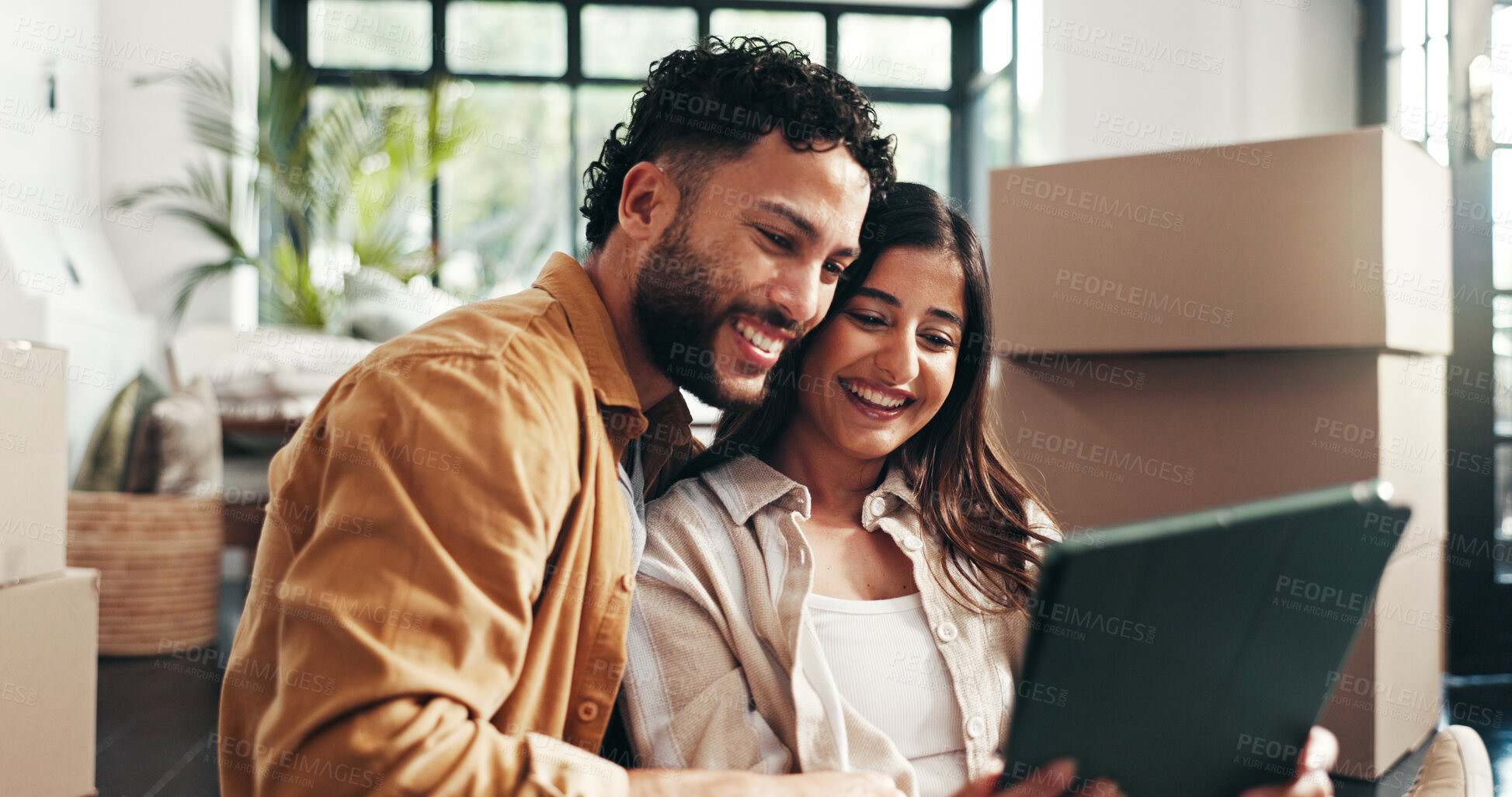 Buy stock photo Boxes, smile and tablet with couple in living room of new home together for property investment. Loan, milestone or mortgage with happy man and woman in apartment for growth, planning or real estate