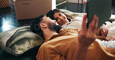 Buy stock photo Smile, couple and relax with tablet in new home for discussion, interior design and online shopping. People, talk and digital with planning, furniture search and boxes for start of renovation process