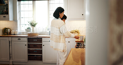 Buy stock photo Mother, carry and baby with coffee in kitchen for caffeine start, prepare drink and morning breakfast. Woman, mom and herbal tea with child for bonding together, parental support and parent at house