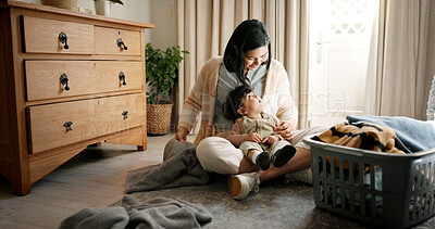 Buy stock photo Home, baby and mother clean laundry on bedroom floor for domestic chores, organize washing and housekeeping. Fresh linen, woman and boy child with packing clothes in basket for bonding and cleaning