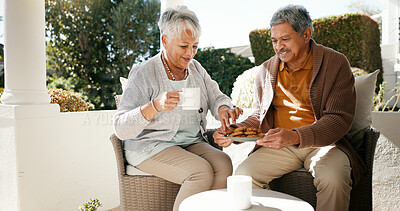 Buy stock photo Outdoor, senior couple and breakfast with tea for love, bonding or biscuits in retirement. Porch, old woman and elderly man with happiness for relationship, eating and cookies with coffee in morning