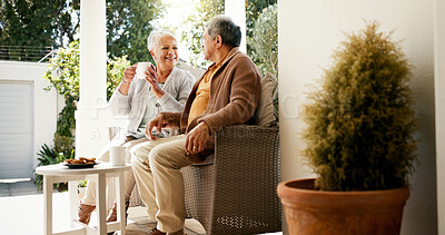 Buy stock photo Bonding, talking and senior couple with coffee, home and elderly people with beverage for chat and morning. Happy, old man and mature woman with tea on patio, comfortable and family with cookies