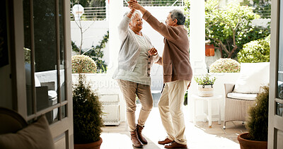 Buy stock photo Mature couple, dancing and spin in home with love, bonding and celebration for anniversary. People, man and woman with holding hands, retirement and smile for twirl, rhythm and relationship at house