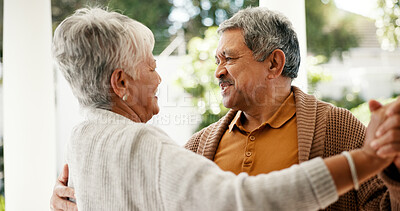 Buy stock photo Senior couple, dancing and love in home with smile, bonding and celebration for anniversary. People, man and woman with holding hands, retirement and happy with rhythm for relationship at house