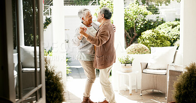 Buy stock photo Senior couple, dancing and smile in home with love, bonding and celebration for anniversary. People, man and woman with holding hands, retirement and happy with rhythm for relationship at house
