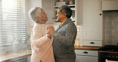Buy stock photo Love, dance and senior couple in home for healthy relationship, connection or holding hands. Retirement, man and woman moving to romance music to celebrate marriage anniversary or smile in kitchen