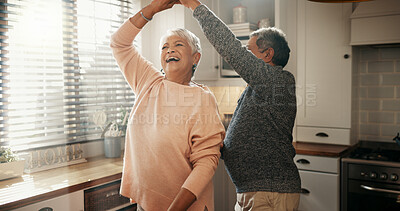 Buy stock photo Dancing, laughing and senior couple in kitchen for bonding, connection or commitment together. Love, romance and elderly man with woman for groove to music in morning for marriage anniversary in home