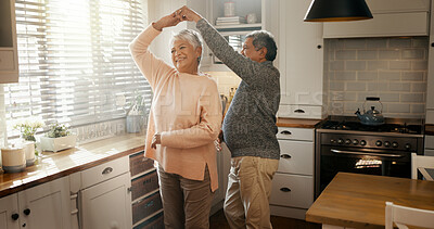 Buy stock photo Happy, dance and senior couple in home for healthy relationship, connection or holding hands. Retirement, man and woman moving with romance music to celebrate marriage anniversary or love in kitchen