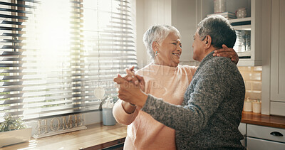 Buy stock photo Smile, dance and senior couple with love in home for healthy relationship, loyalty or holding hands. Retirement, man and woman moving with romance music to celebrate marriage anniversary in kitchen