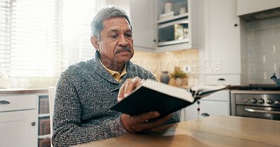 Buy stock photo Reading, prayer and bible with old man in kitchen for worship, spiritual or Christian religion. Faith, gospel and inspiration with person and book at home for Jesus Christ, catholic and scripture