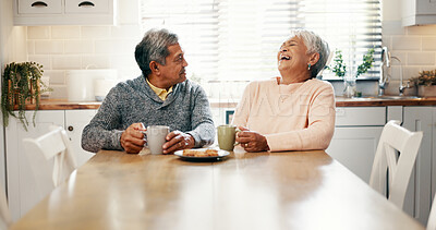 Buy stock photo Home, old couple and breakfast with coffee for laughing, bonding and biscuits with talking in retirement. Senior people, woman and man with smile for love, funny joke and cookies with tea in kitchen