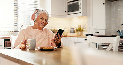 Buy stock photo Coffee, music and senior woman with phone in home for streaming subscription, app and entertainment. Headphones, eating and mature person with food, smile or mobile for retirement, radio and podcast