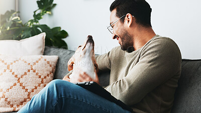 Buy stock photo Smile, man and relax with dog in home for love, care and bonding together as friends or companion. Pet animal, scratch and person in living room on sofa for support, connection and play with tablet