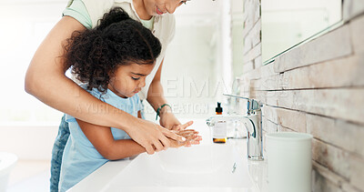 Buy stock photo Washing hands, girl and teaching with soap, faucet and helping with kid, care and bacteria in home. Mother, child and cleaning with liquid, water or routine for wellness in morning at family house