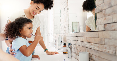 Buy stock photo Girl, mom and child brushing teeth for learning, morning routine or teaching healthy oral habits in home. Happy parent, kid and cleaning for dental care in bathroom with toothbrush, mother or hygiene