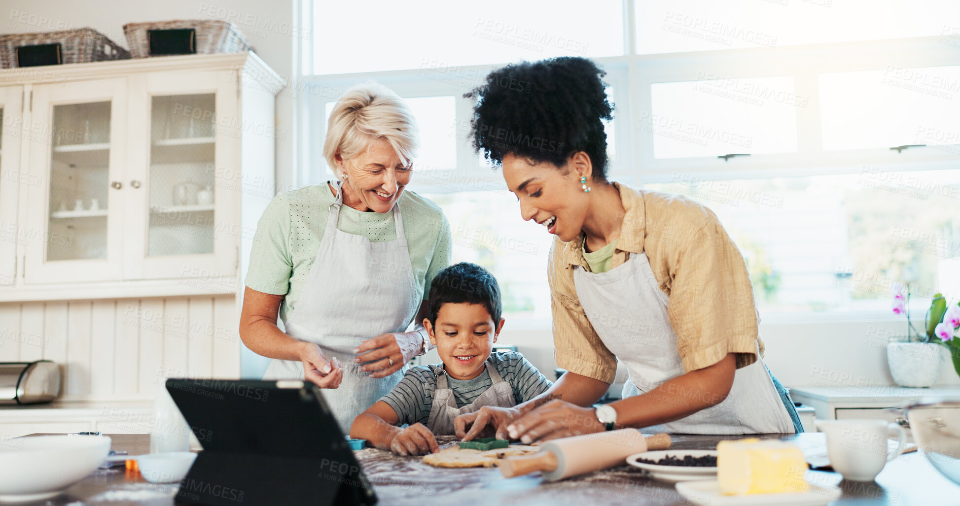 Buy stock photo Tablet, family and mother baking with child in kitchen for online cookie recipe, video tutorial or development. Happy people, grandmother and teaching boy with dessert, snack preparation and learning