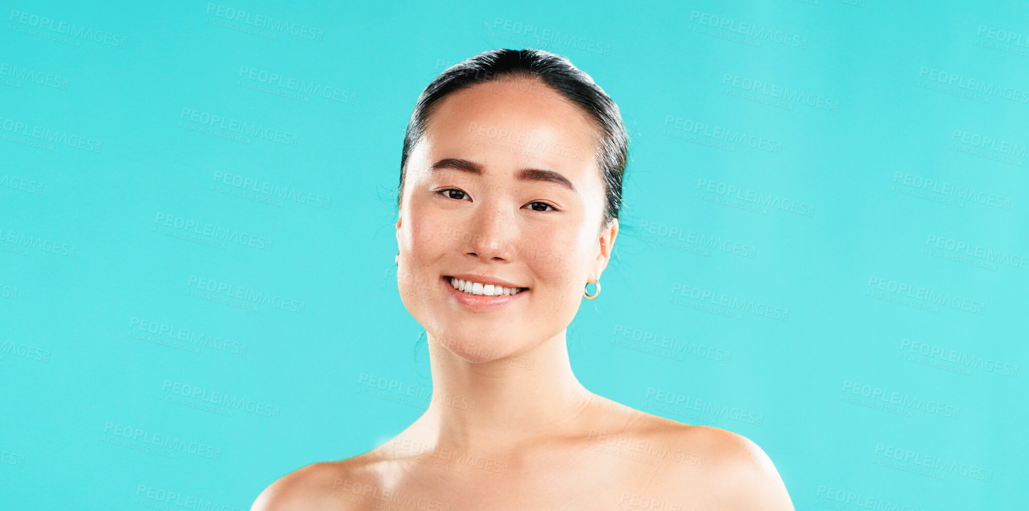 Buy stock photo Beauty, skincare and portrait of Asian woman in studio for wellness, cosmetics and facial treatment. Dermatology, mockup space and person for healthy skin, salon and spa benefits on blue background